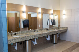 Commercial restroom with granite countertops built by Curington Contracting in Florida