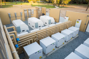 Multiple rooftop HVAC units installed on an industrial facility roof by Curington Contracting in Florida.