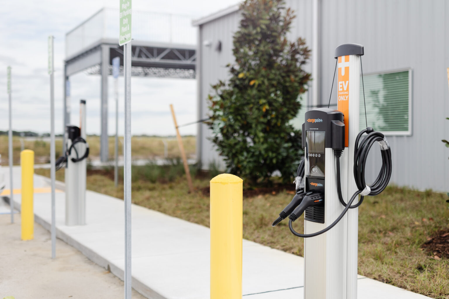 Electric vehicle charging stations installed outside solar operations center