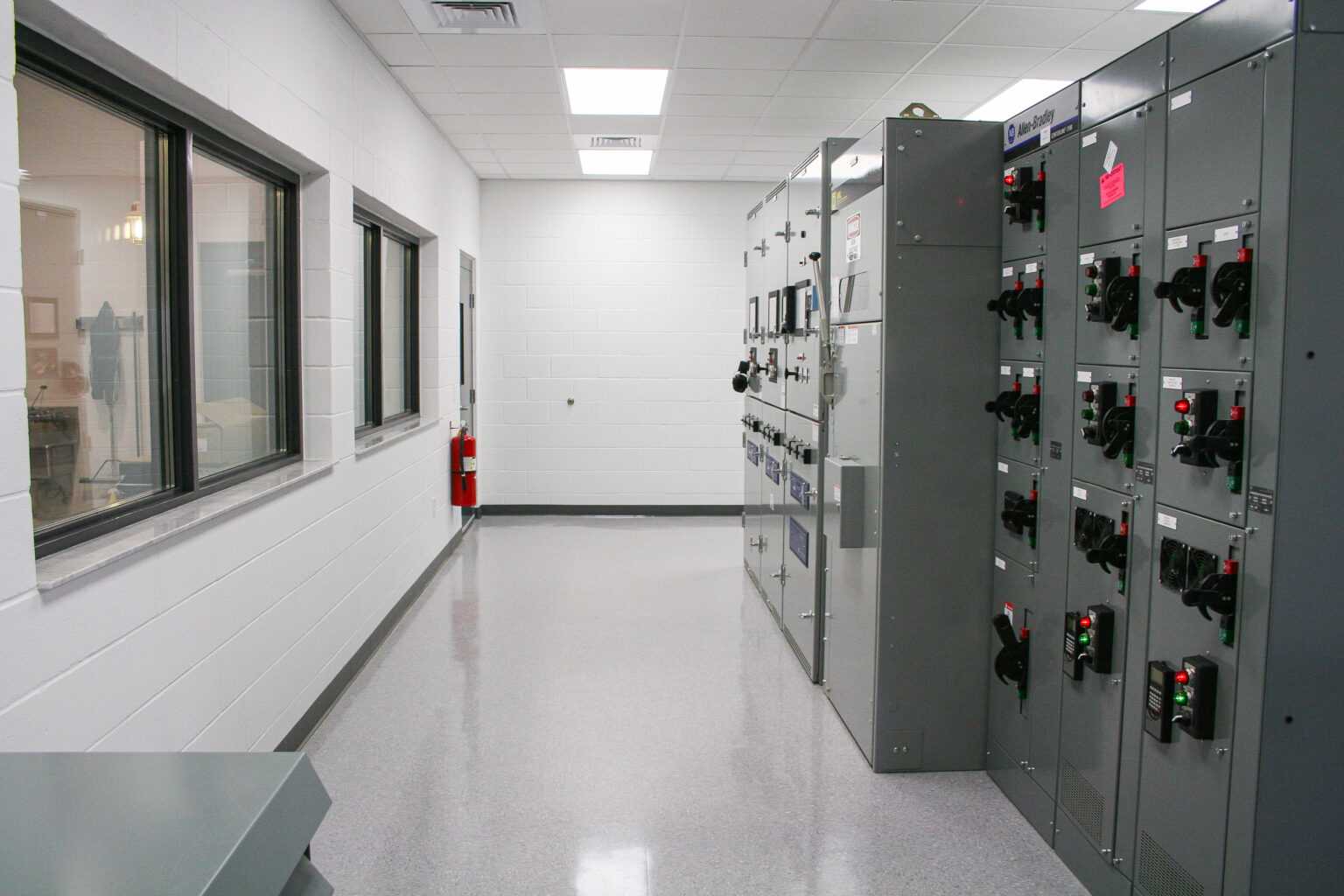 Clean industrial electrical room with control panels and equipment